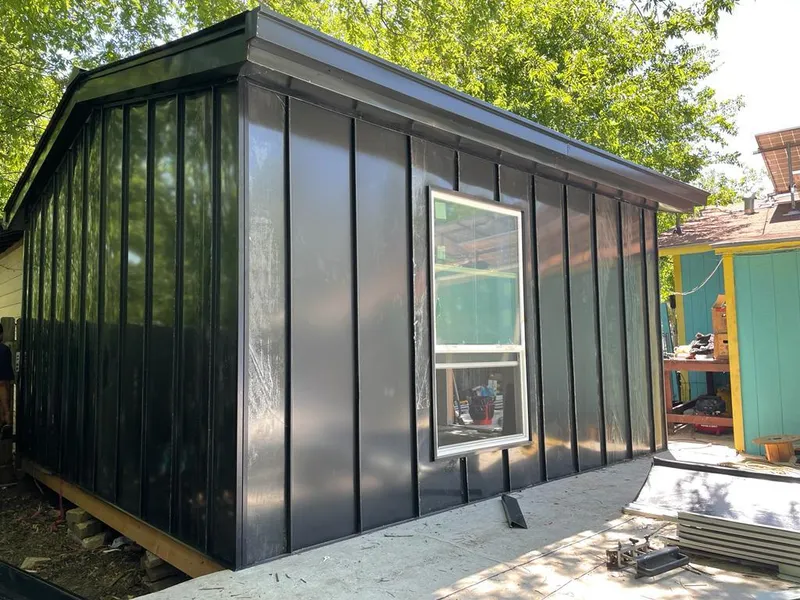 Black standing seam metal wall panels for Metal Roof Installation in Grand Rapids